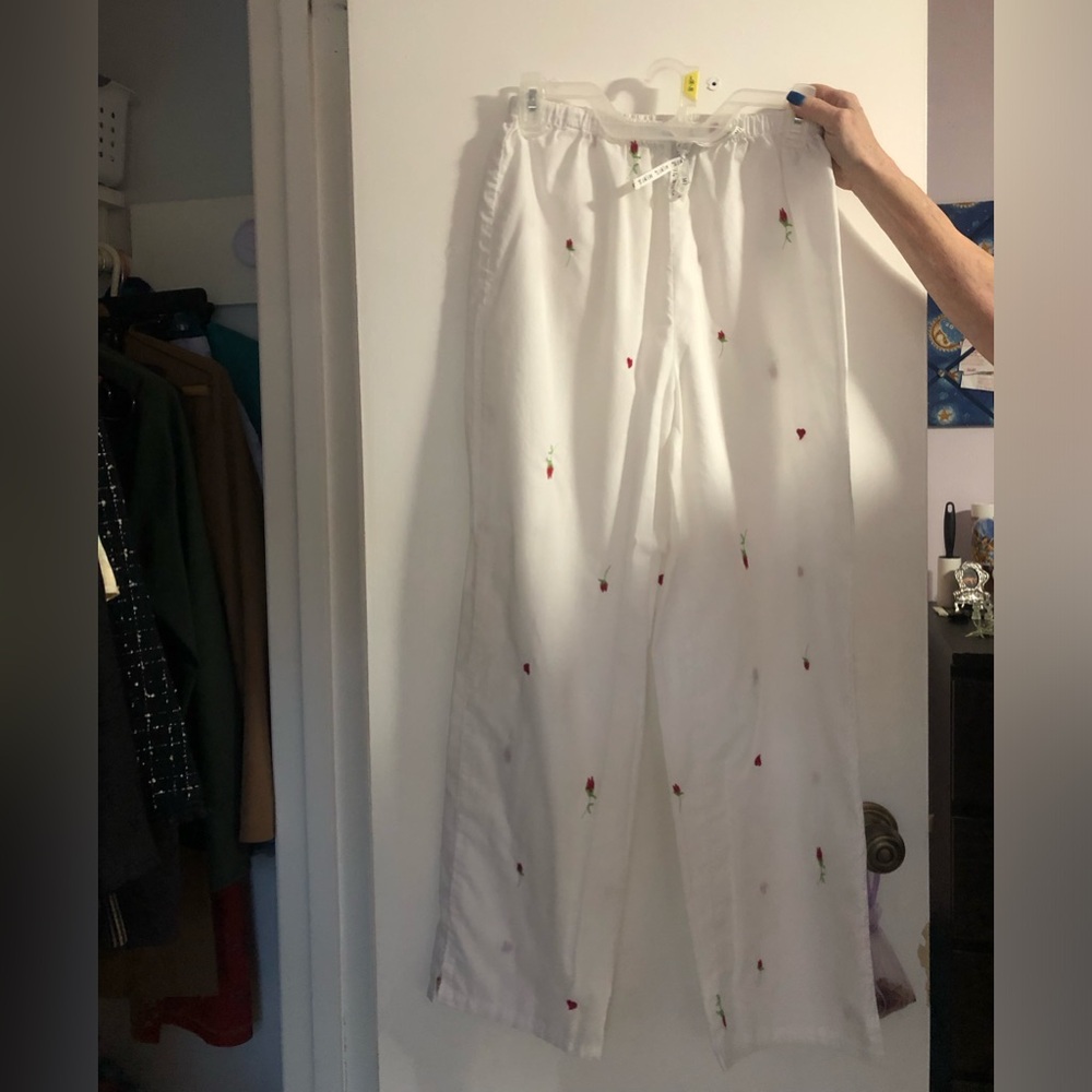 White pants with roses on it